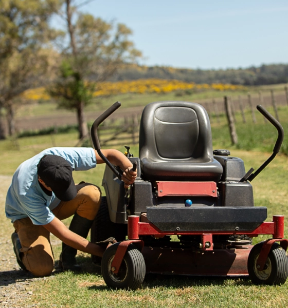 a person repairing a small cart
